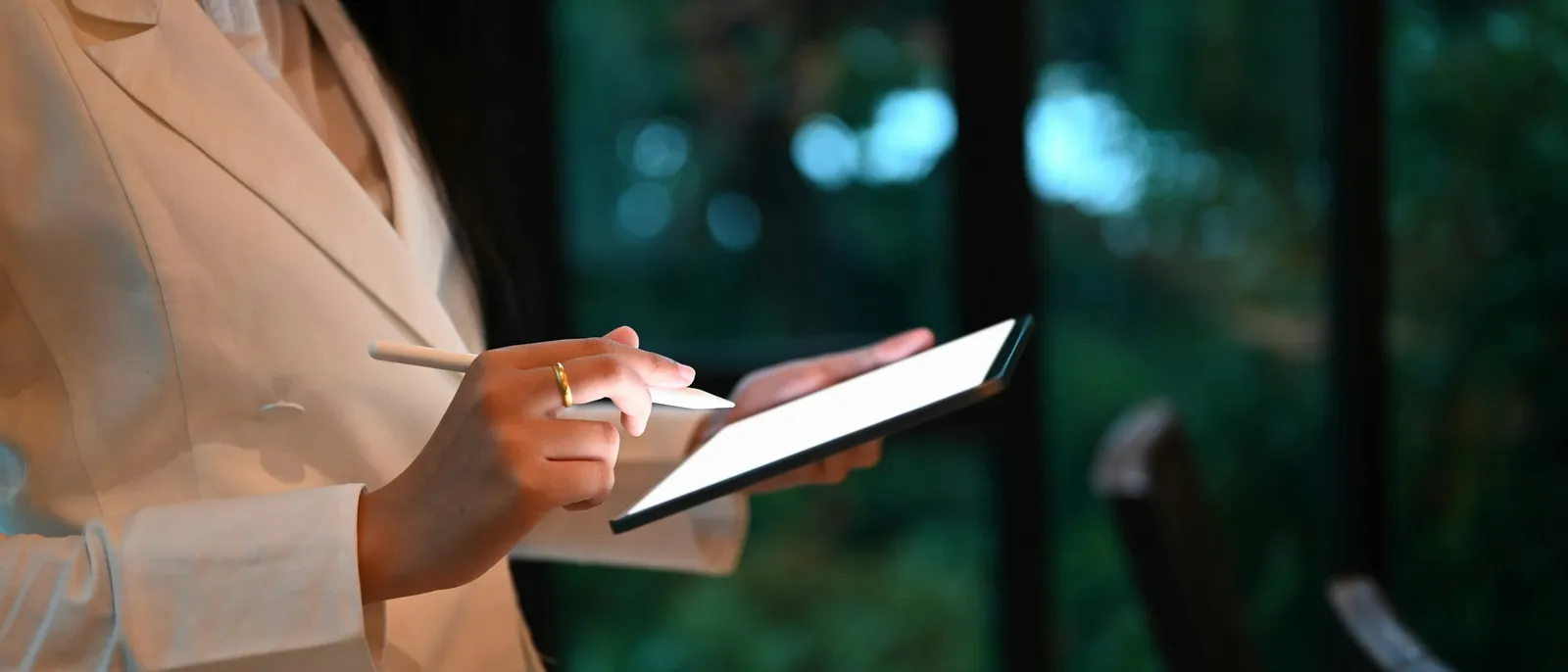 A clinician reviewing data on a tablet